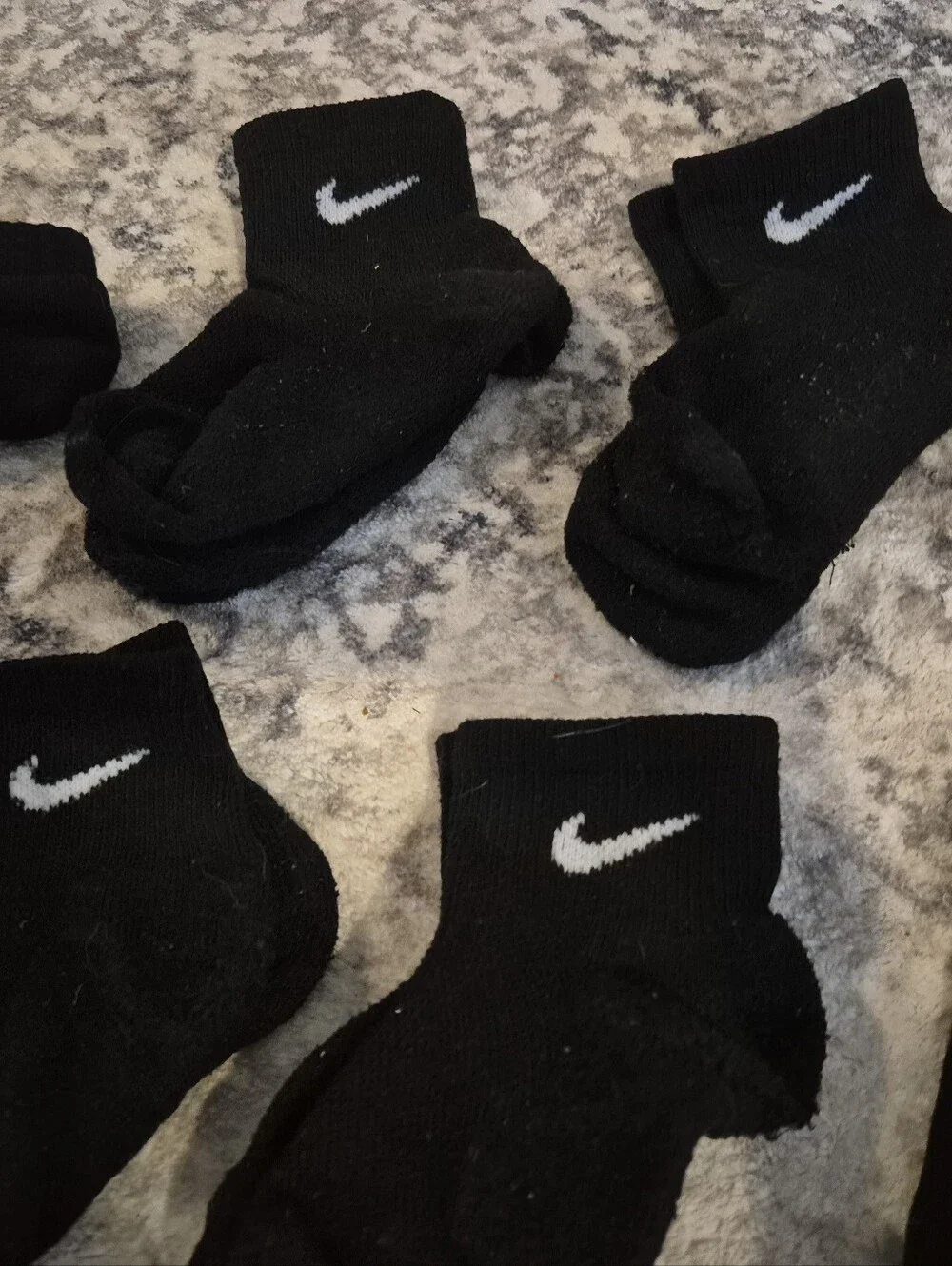 8 pairs of Nike black xs socks and 3 extra no matches socks